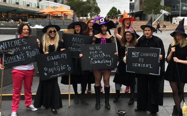 Broomstick-Toting Witches Staged A Protest Outside Peter Dutton’s Office