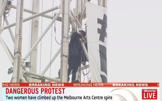 Protesters Scale 162M Melbourne Arts Centre With #LetThemStay Banner