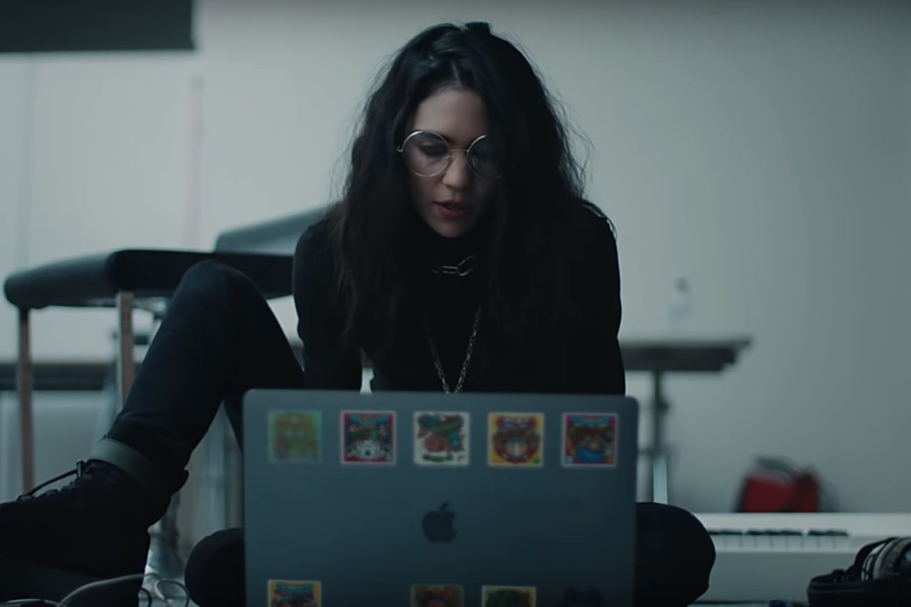 Grimes Is Channelling Some Srs ’90s Goth Vibes In The New Apple Ad Campaign