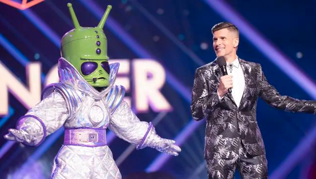 ‘The Masked Singer’ Host Osher Reveals Just How Fucken Intense Security Was On Set