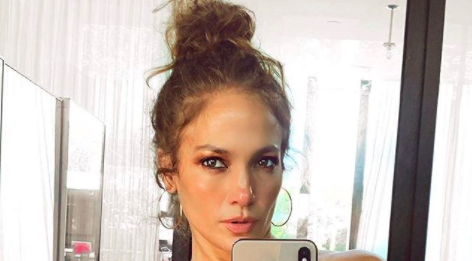 J.Lo Fans Have Spotted A Random Man Hiding In The Background Of Her Selfie & Is This ‘Parasite’ IRL?