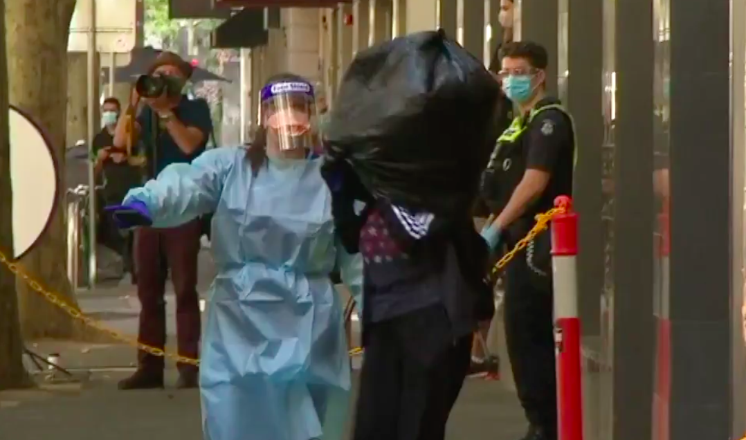 In Chaotic Scenes, The Holiday Inn Evacuated Quarantined Guests W/ Garbage Bags On Their Heads